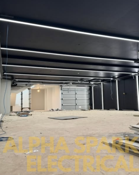 Finished matte black ceiling with recessed linear LED lighting strips